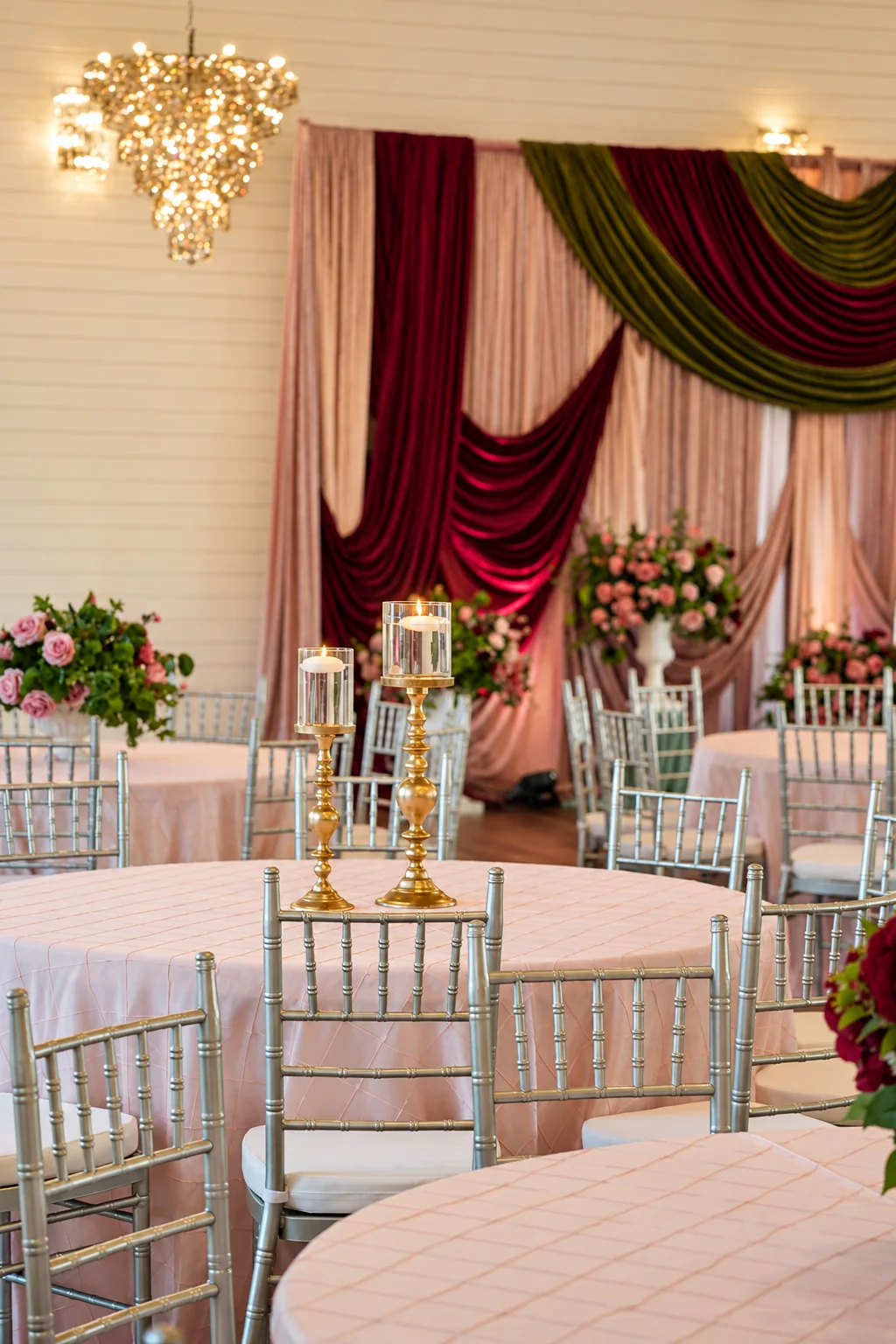 Warmly lit event setup inside the ranch ballroom